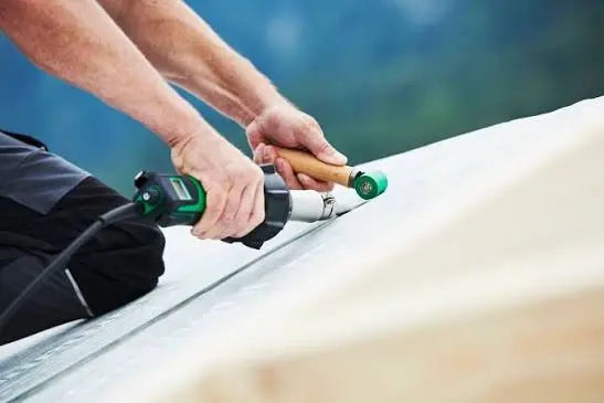 person holding tools and working